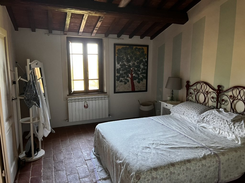 Double bedroom with beamed ceiling