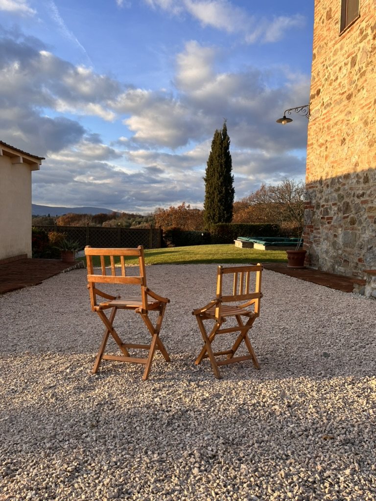 Garden chairs in the late afternoon sun at Casa Trattino